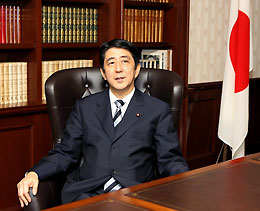Newly elected Japanese ruling Liberal Democratic Party (LDP) President Shinzo Abe smiles as he settles into the presidential seat at the LDP headquarters in Tokyo September 20, 2006.