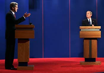 U.S. President George W. Bush makes a point during the first presidential debate with Democratic nominee John Kerry, at the University of Miami in Coral Gables, Florida September 30, 2004. The 90-minute, televised session will give voters their first chance to compare the candidates directly.