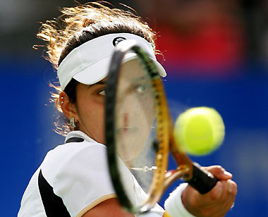 India's Sania Mirza hits a forehand during her first round match against Slovakia's Daniela Hantuchova at the Sydney International tennis tournament January 9, 2006. Hantuchova defeated Mirza 6-4 2-6 6-2. [Reuters]