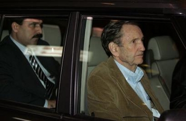 Former U.S. attorney general Ramsey Clark, one of Saddam's lawyers, front, and Saddam's chief Iraqi lawyer Khalil al-Dulaimi , back, leave in a car upon their arrival in Amman Airport, Wednesday, Jan. 25, 2006.