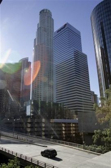 The U.S. Bank Tower, formerly known as the Library Tower, stretches above other buildings in downtown Los Angeles Thursday, Feb. 9, 2006.