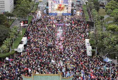 Thousands of supporters of Taiwan's main opposition Nationalist Party gather in front of the presidential office during a protest march in Taipei March 12, 2006. Thousands of people marched through Taiwan's capital on Sunday to denounce President Chen Shui-bian, accusing him of fanning tensions with neighbouring China.