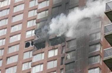 Reuters - Wed Oct 11, 4:33 PM ET Smoke billows out of the windows of a high-rise building after a small aircraft crashed into it in New York, October 11, 2006.
